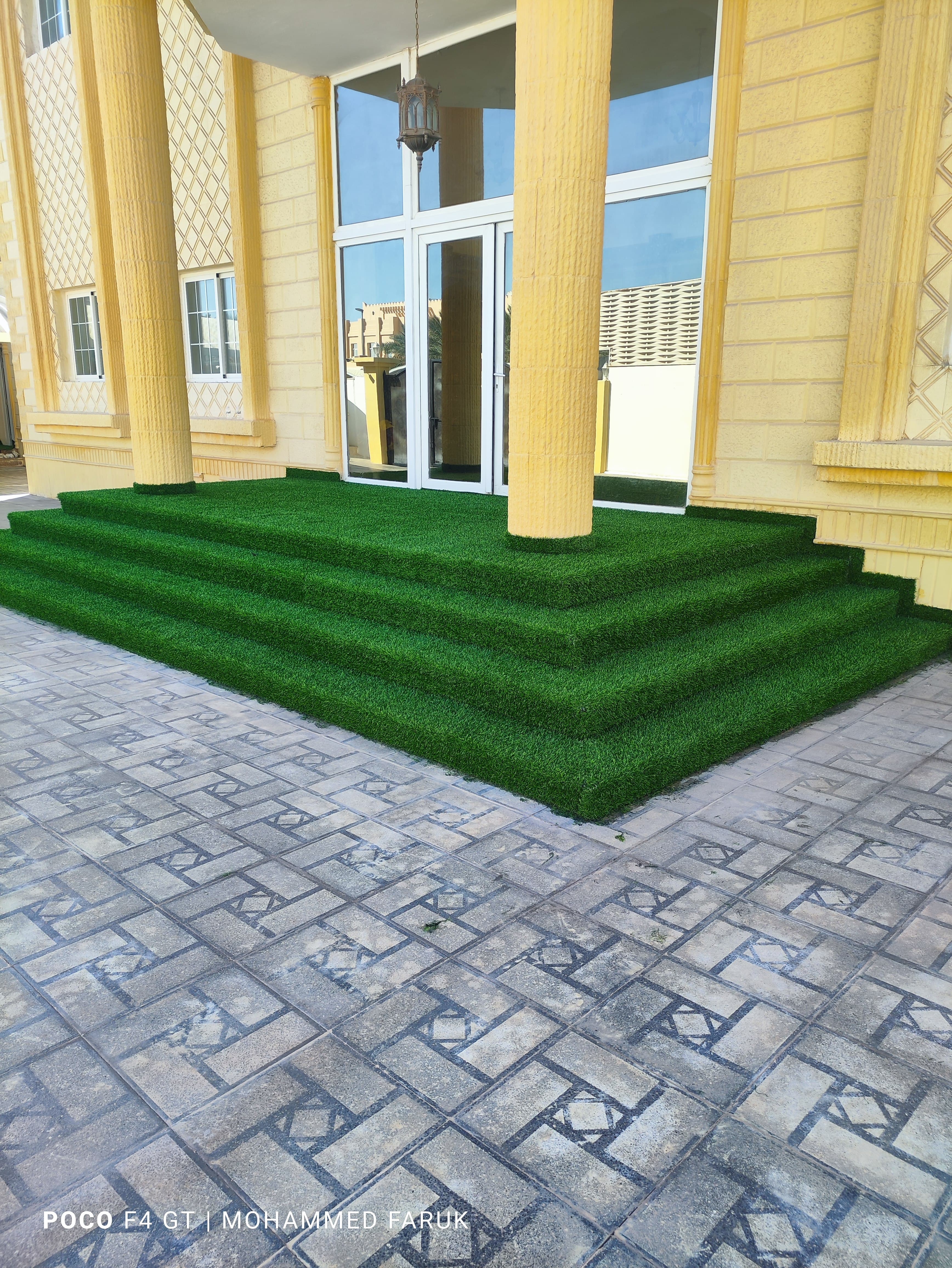 Artificial grass laid over the entrance steps and forecourt of a villa in Qatar